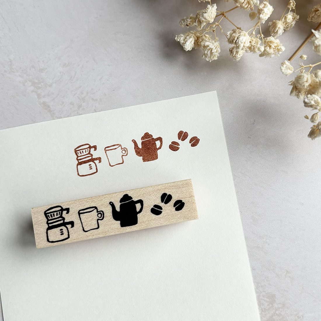 Hankodori hand-carved rubber stamp with coffee grinder, pour-over kettle, beans, and cup design