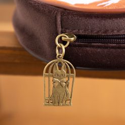 Brass Jiji in a birdcage zip charm on the Kiki's Delivery Service pouch