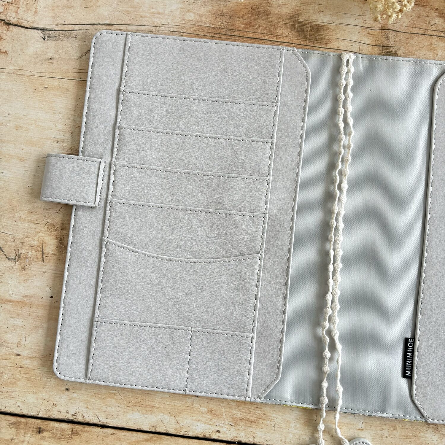 butterfly pattern in vibrant yellow, plus greys and browns, and a pale grey vegan 'leather' trim.
