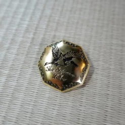 The Superior Labor Crane Brass Charm