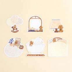 Papier Platz sticker flakes by Nakauchiwaka showing teddy bear bedroom scenes, packaged with surrounding die-cut stickers on a yellow background.
