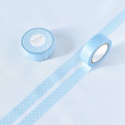 Light blue polka dot washi tape by Papier Platz, shown rolled and partially unrolled on a white background.