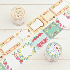 Papier Platz PuPuPu sticky roll showing assorted label designs including bread, fruit, and decorative frames, with rolls displayed alongside.