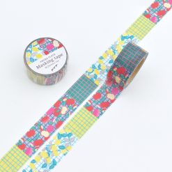 Papier Platz Pupupu washi tape with colourful fruit illustrations and grid patterns in teal, yellow and pink tones, shown unrolled next to the matching roll.