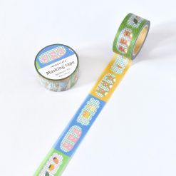 Papier Platz washi tape featuring repeating illustrated animal scenes inside patterned frames, shown partially unrolled next to the roll.