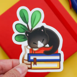 Thousand Skies Vinyl Sticker - Cat Napping On Books
