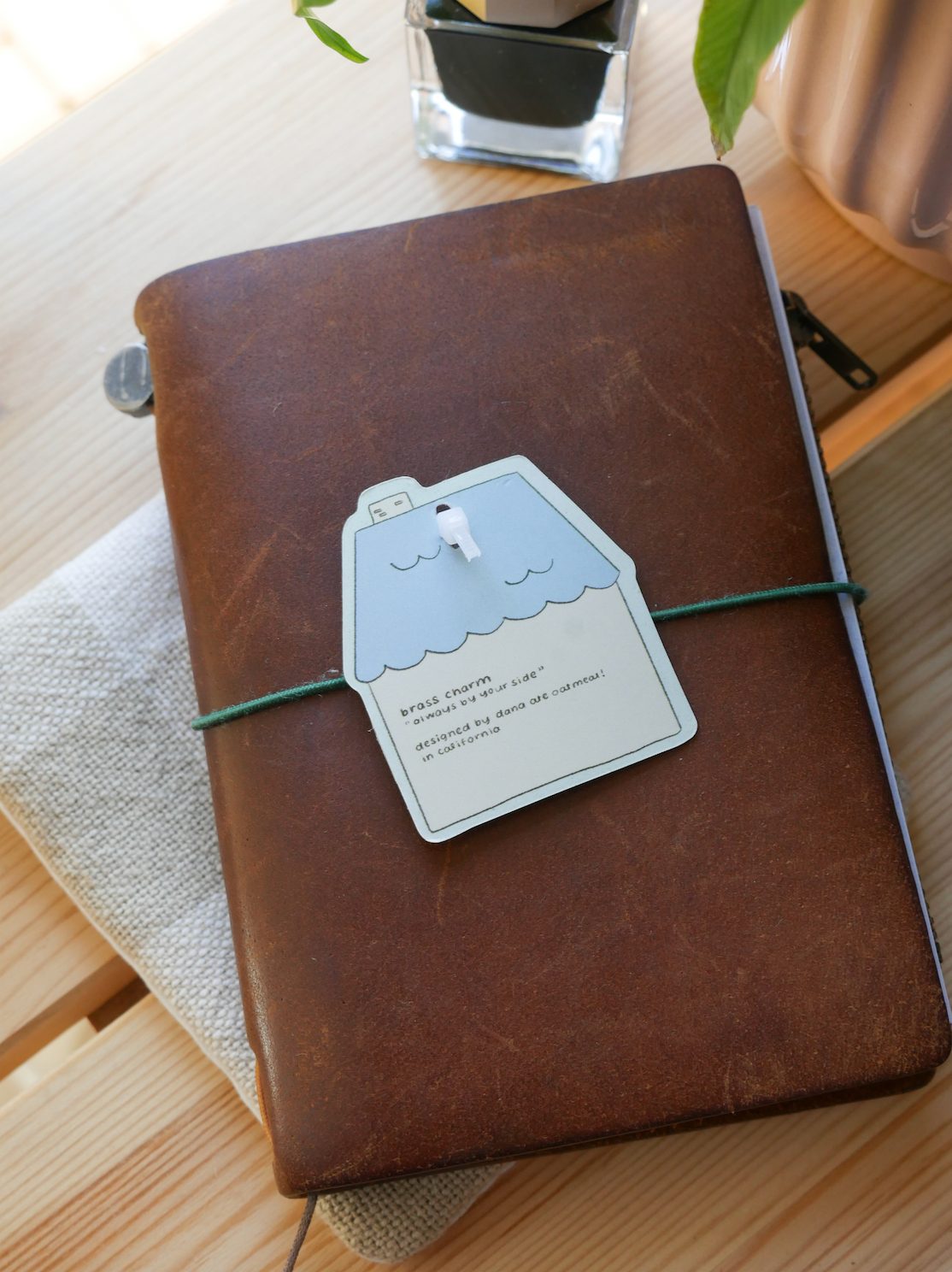 Dana Ate Oatmeal Brass Charm – Always by Your Side — gallery