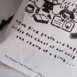 Close-up detail of the branding text on an Eileen Tai drawstring pouch reading “Love from Malaysia”.
