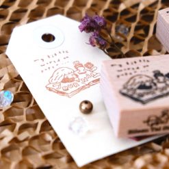 Close-up of the Eileen Tai journal girl wooden rubber stamp