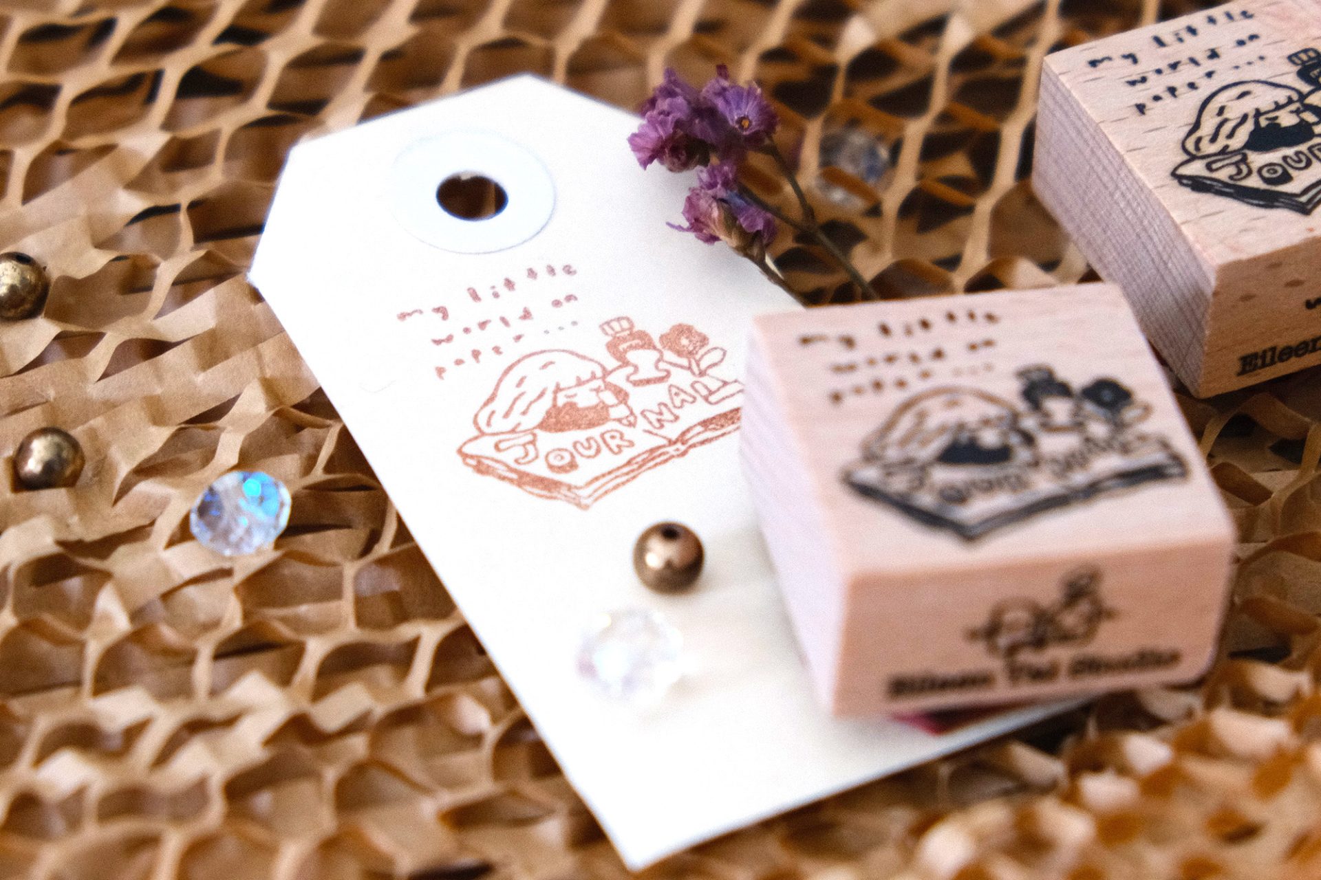 Close-up of the Eileen Tai journal girl wooden rubber stamp