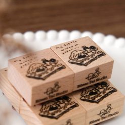Detail view of a journal girl illustration stamped using an Eileen Tai rubber stamp.