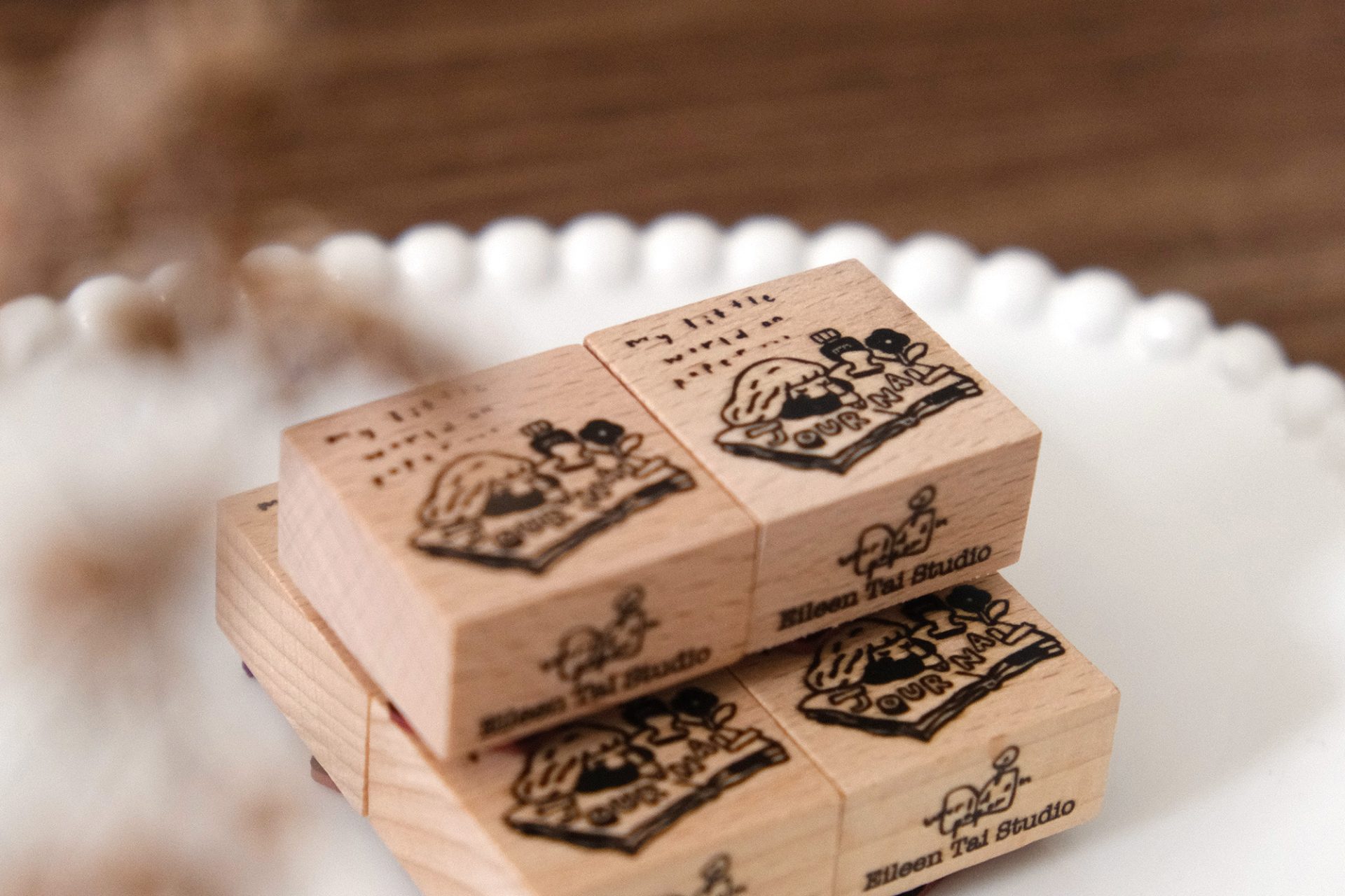 Detail view of a journal girl illustration stamped using an Eileen Tai rubber stamp.