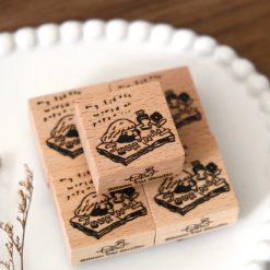 Journal girl illustration stamped on a paper tag using an Eileen Tai wooden rubber stamp.