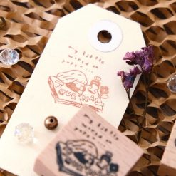 Stacked view of Eileen Tai journal girl rubber stamp blocks in a styled flat lay.