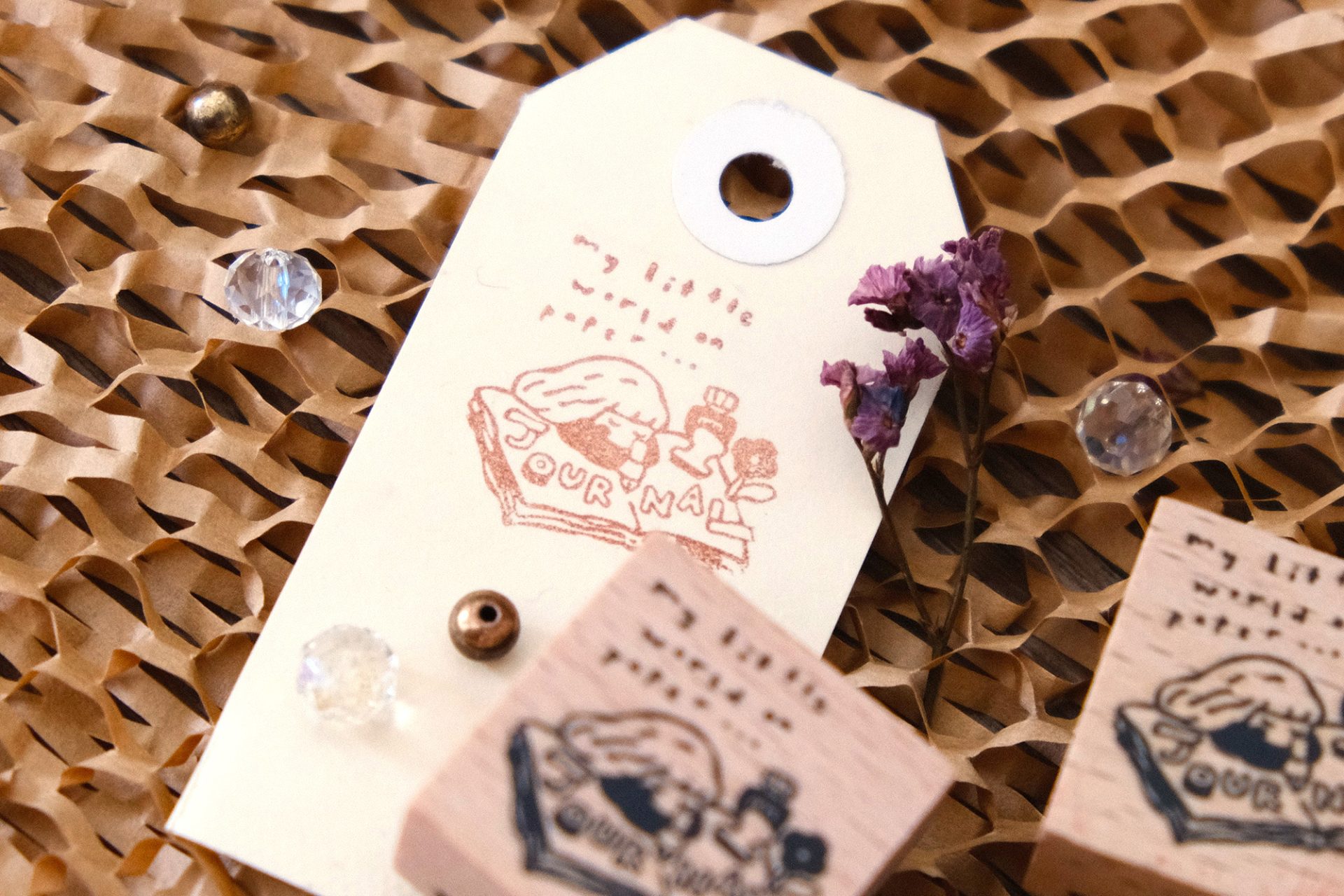 Stacked view of Eileen Tai journal girl rubber stamp blocks in a styled flat lay.
