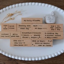 Full My Daily Dilemma rubber stamp set by Eileen Tai arranged together in a flat lay.