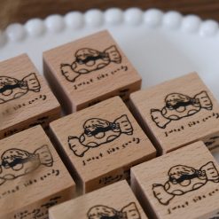 Eileen Tai Sweet Like Candy wooden rubber stamp shown with a stamped candy illustration on a paper tag.