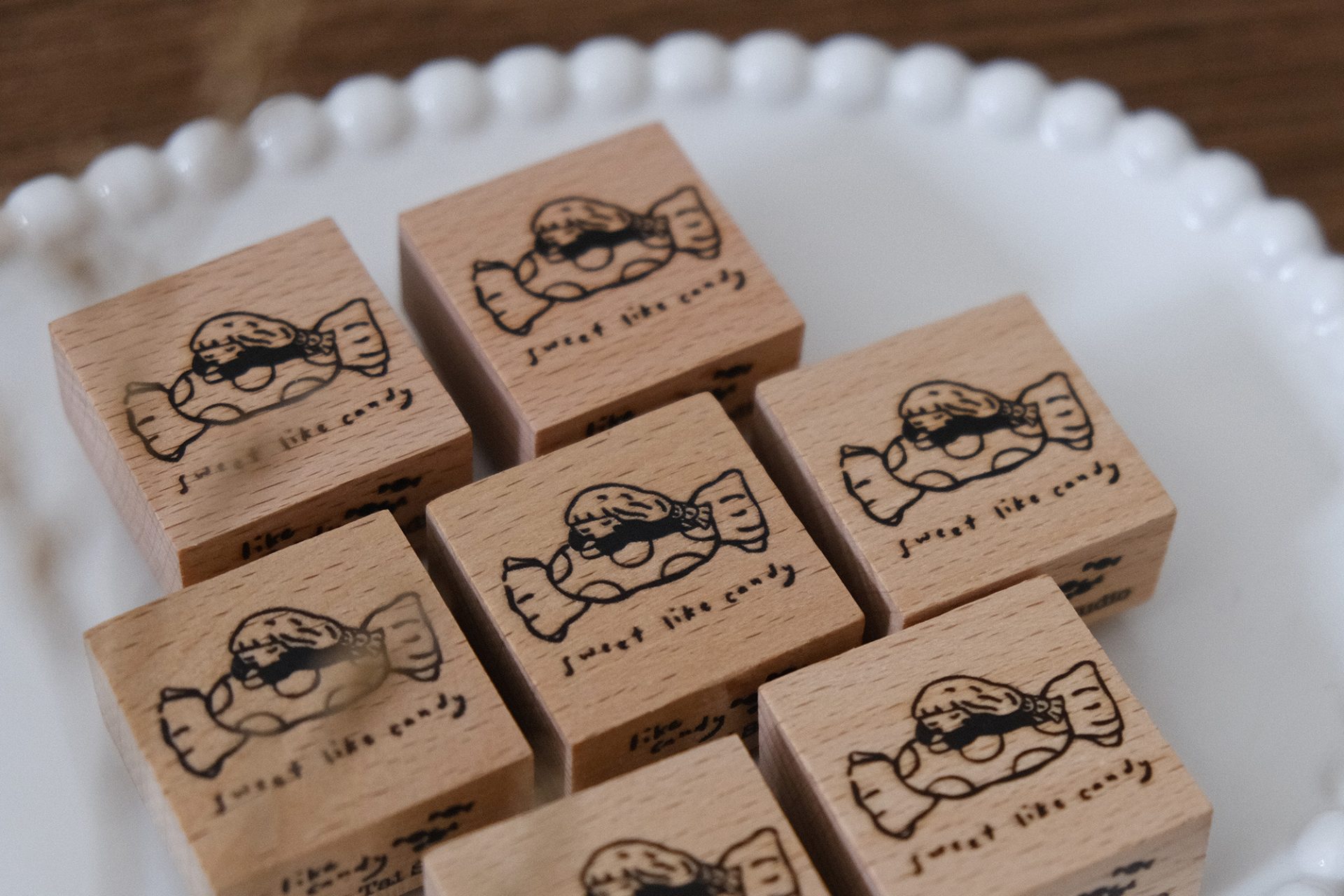Eileen Tai Sweet Like Candy wooden rubber stamp shown with a stamped candy illustration on a paper tag.