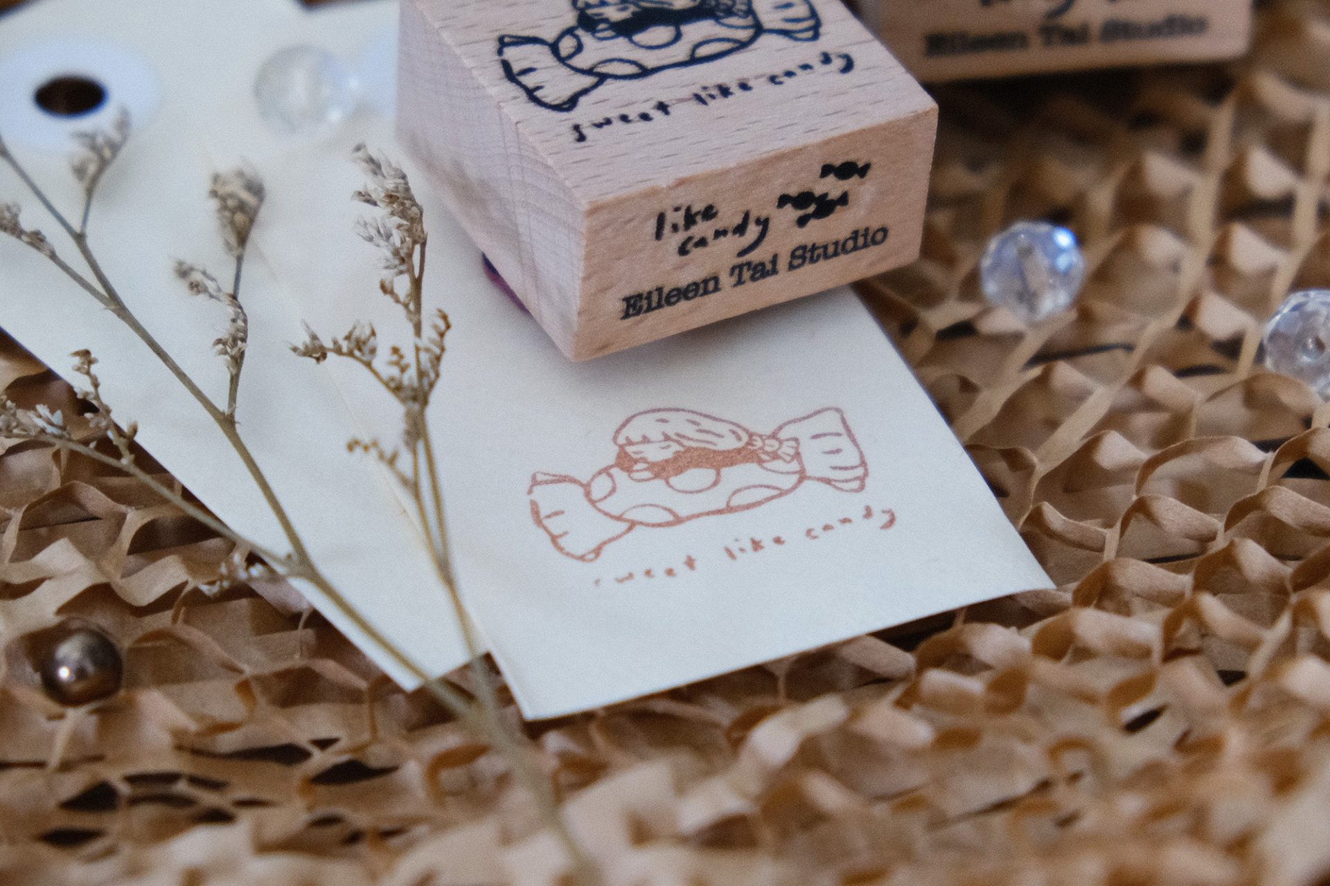 Pair of Sweet Like Candy rubber stamps by Eileen Tai Studio styled on a textured background.