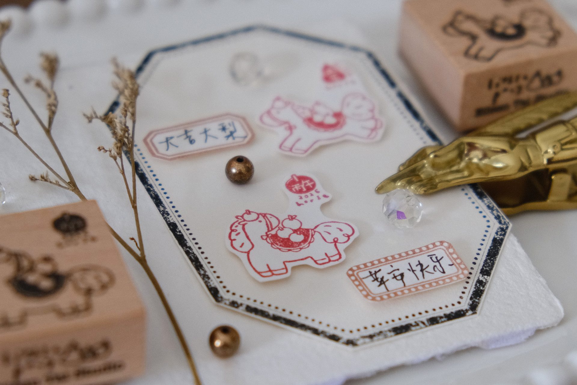 Close-up of the Eileen Tai Year of the Horse wooden rubber stamp featuring an apple-themed horse design.