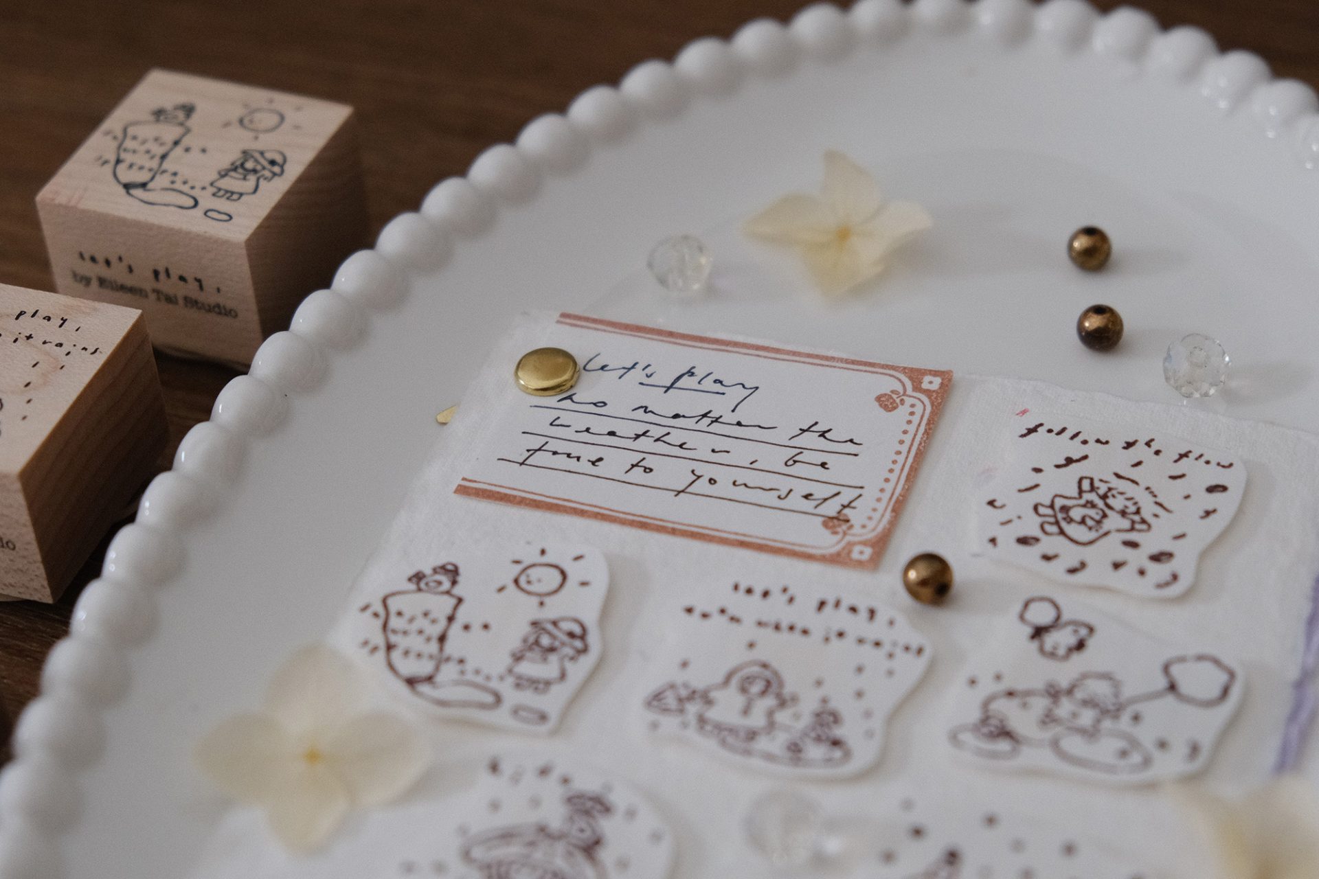 Weather-themed wooden stamps from the Let’s Play collection used in a journaling setup.