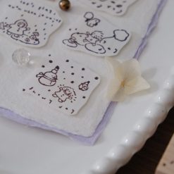Snowy day illustration stamped from the Let’s Play weather stamp featuring falling snow