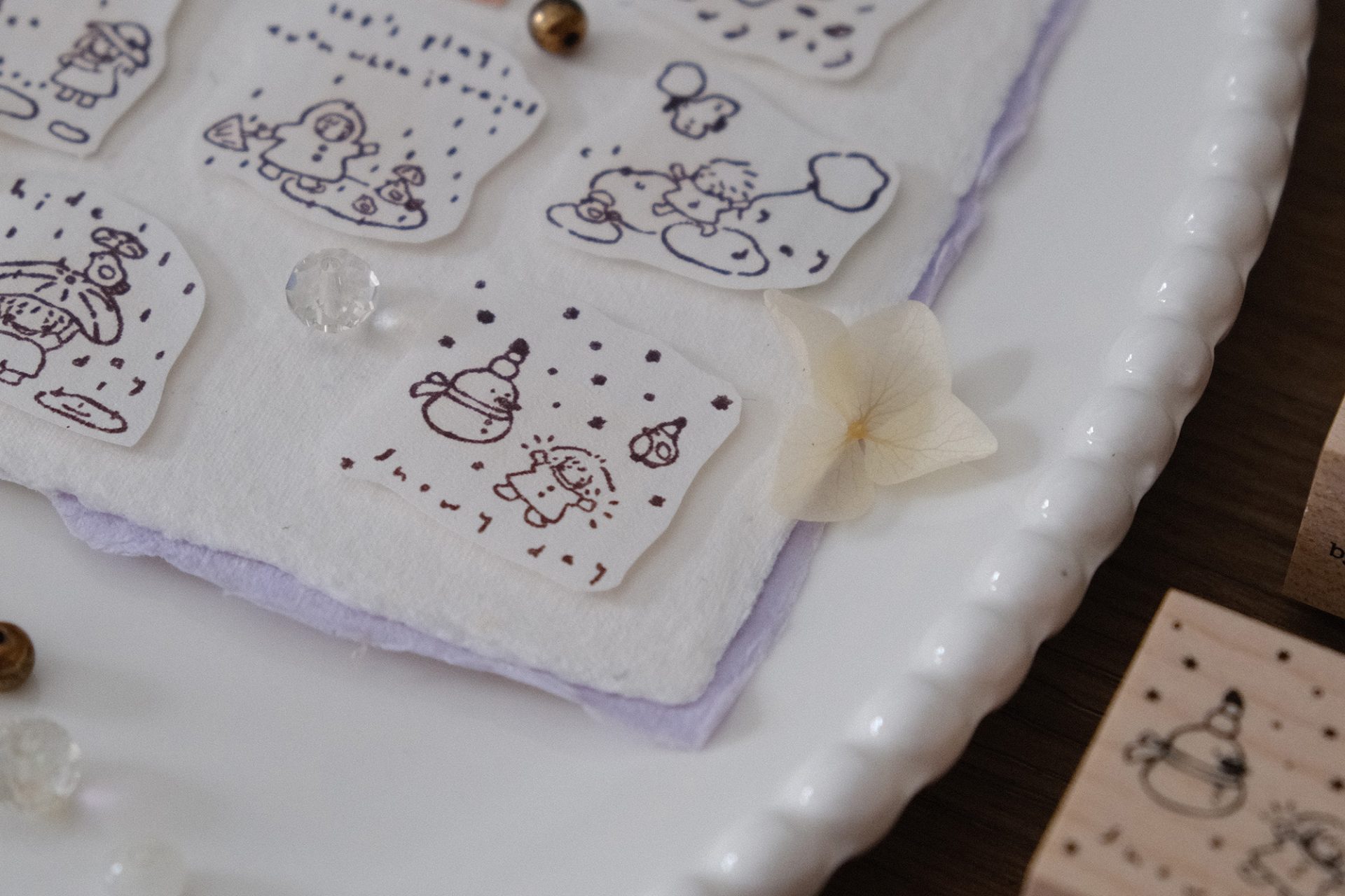 Snowy day illustration stamped from the Let’s Play weather stamp featuring falling snow