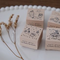 Wooden rubber stamp with a snowy day illustration from the Let’s Play weather series.
