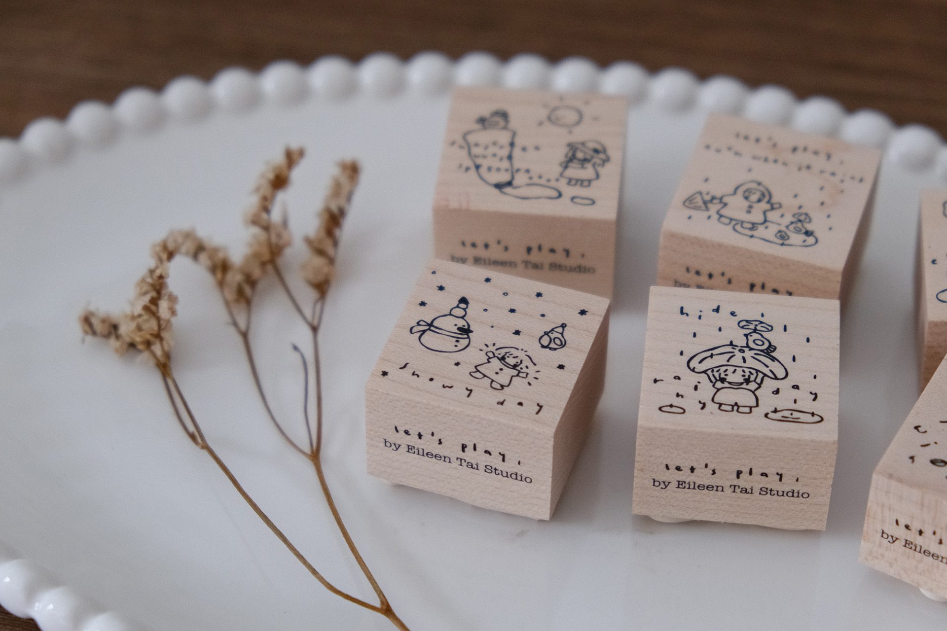 Wooden rubber stamp with a snowy day illustration from the Let’s Play weather series.