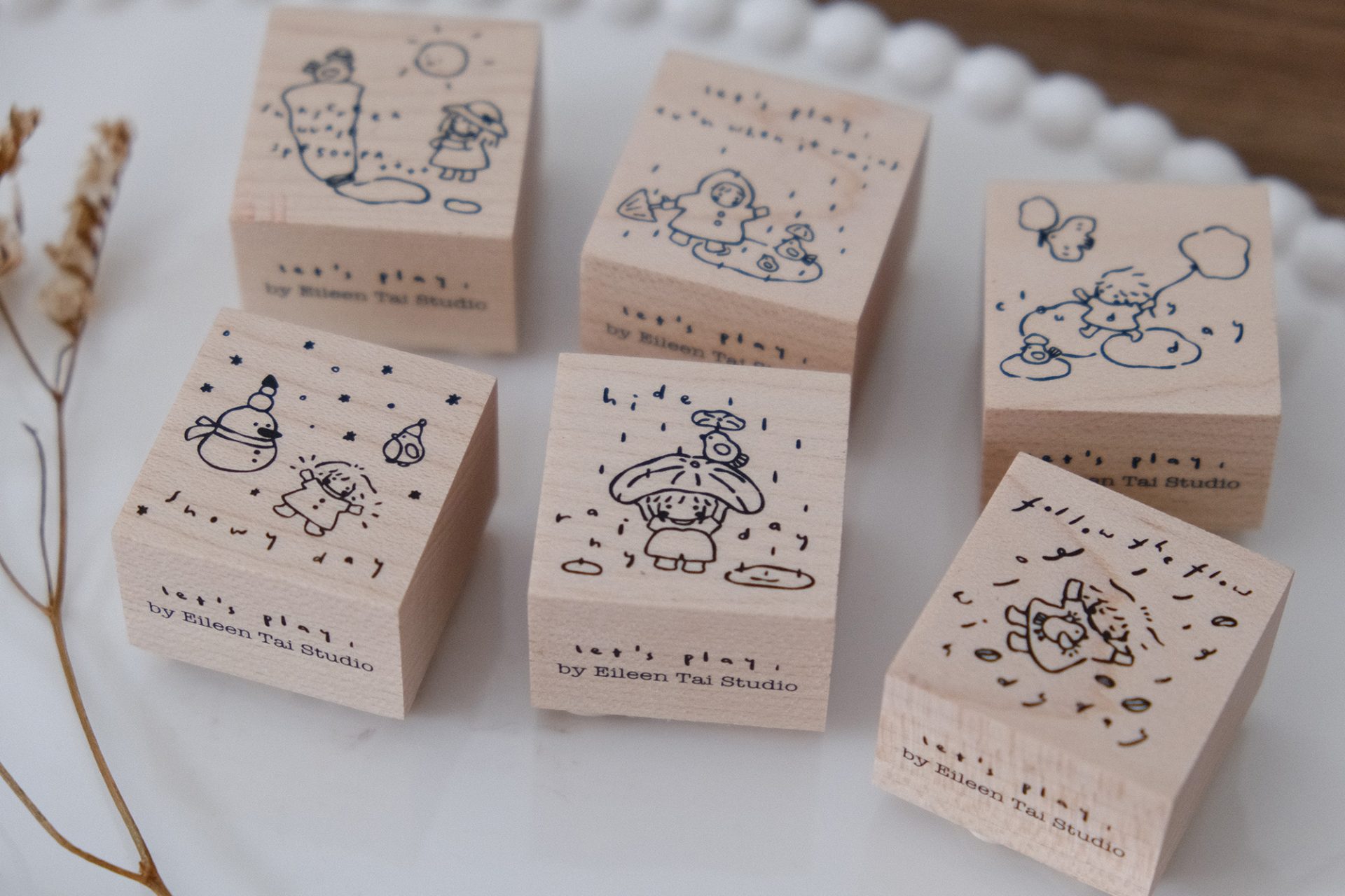 Wooden weather-themed rubber stamp set from the Let’s Play collection by Eileen Tai Studio.