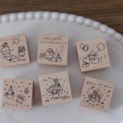 Let’s Play weather-themed wooden stamps shown as stamped impressions in a journaling layout.