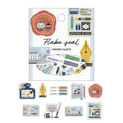 Close-up of individual writing-themed washi stickers with notebooks, ink bottles, stamps, and positive stationery messages.