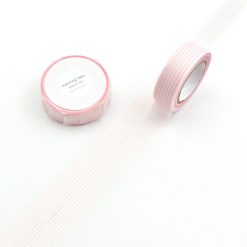 Pink Papier Platz grid masking tape roll with fine grid pattern unrolled on a white background.
