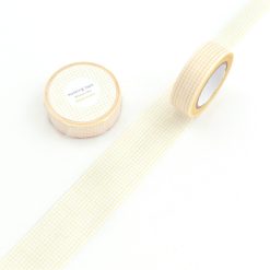Yellow Papier Platz grid masking tape roll shown unrolled on a white background.