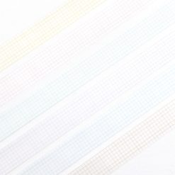 Close-up view of multiple Papier Platz grid masking tape colours laid out in parallel strips showing fine grid detail.