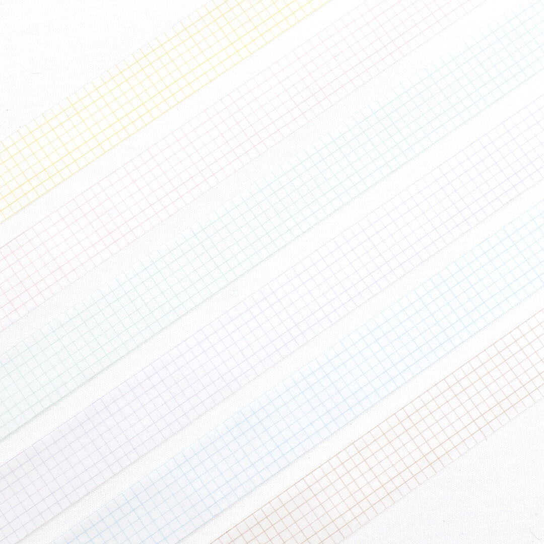 Close-up view of multiple Papier Platz grid masking tape colours laid out in parallel strips showing fine grid detail.